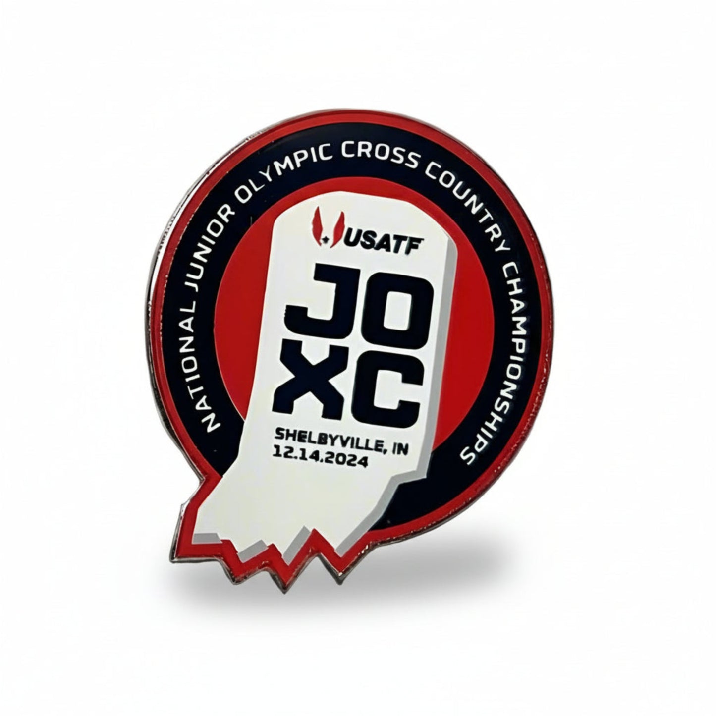A round red, white, and navy lapel pin with text and logo detailing the 2024 USATF National Junior Olympic Cross Country Championships