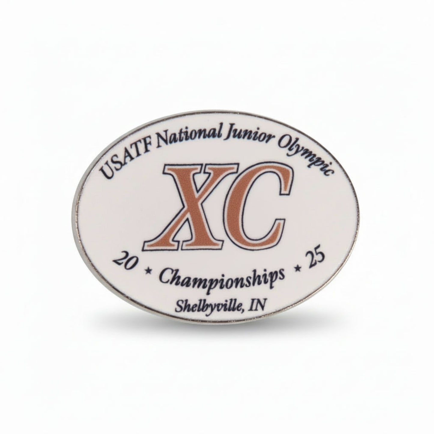Oval-shaped badge with USATF National Junior Olympic XC Championships text on a white background