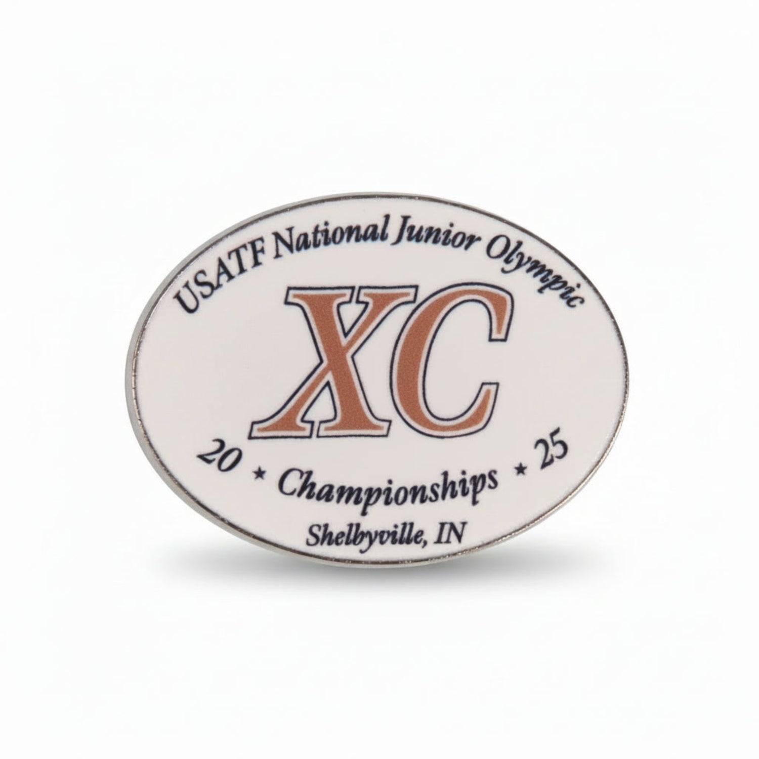 Oval-shaped badge with USATF National Junior Olympic XC Championships text on a white background
