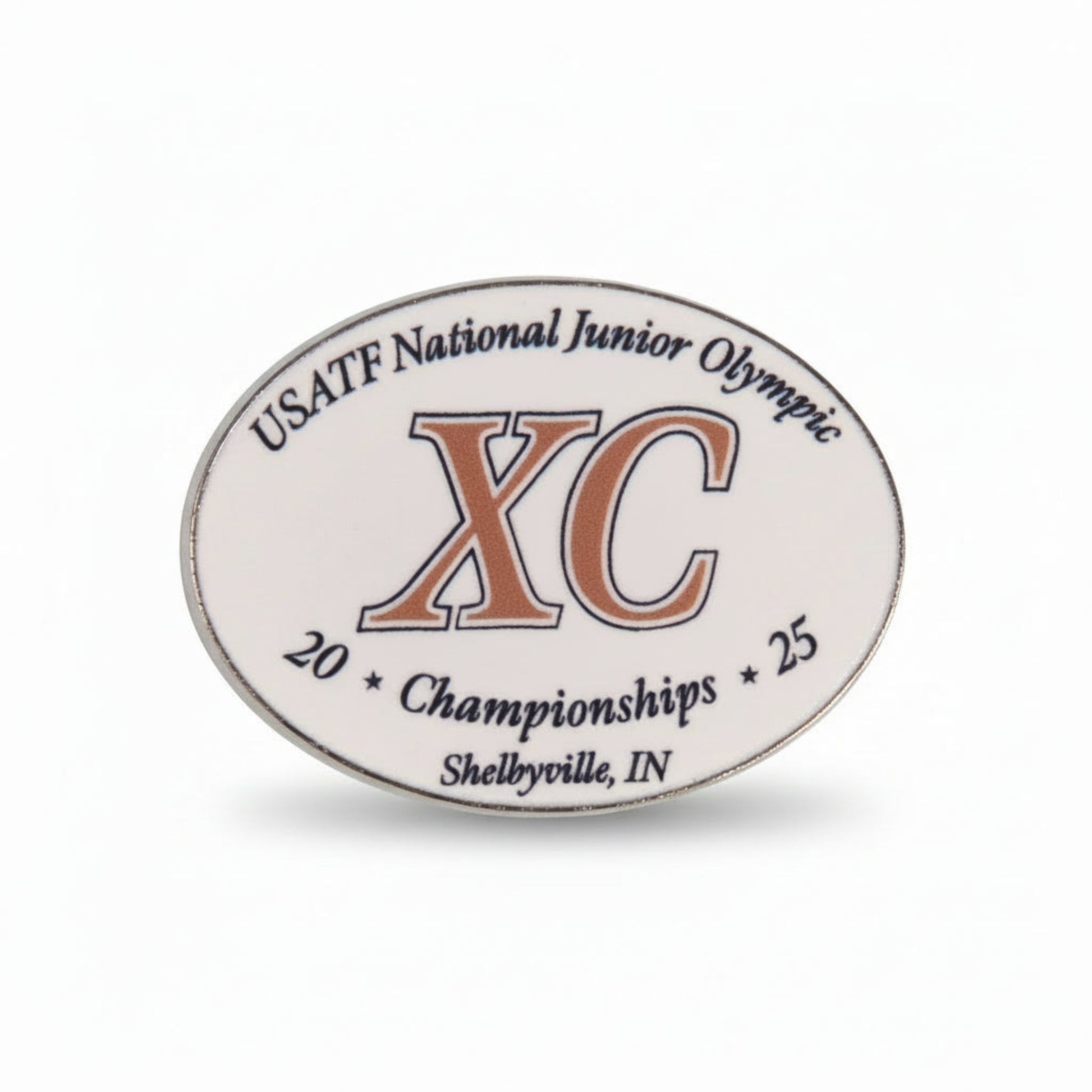 Oval-shaped badge with USATF National Junior Olympic XC Championships text on a white background