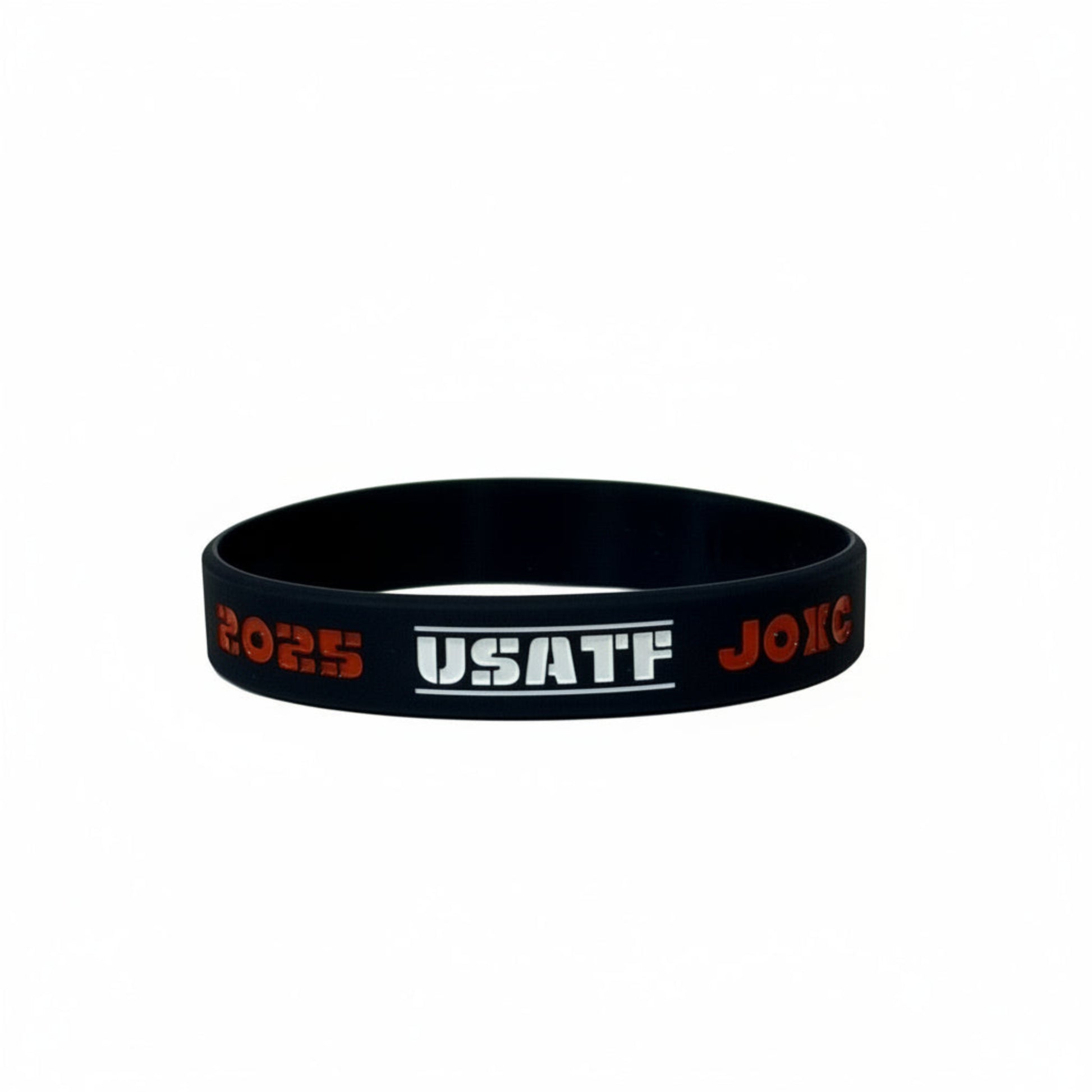Navy wristband with red and white text on a light gray background