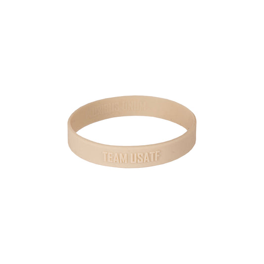 Beige wristband with 'TEAM USATF' text on a white background