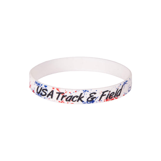 White wristband with red and  blue splatter and 'USA Track & Field' text on a white background