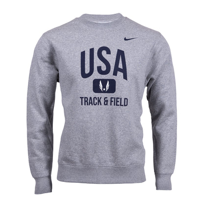 A grey Nike Sportswear Club Fleece Crew sweatshirt with 'USA TRACK & FIELD' text on the front.